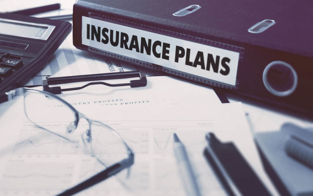 Insurance Plans on Ring Binder. Blured, Toned Image.